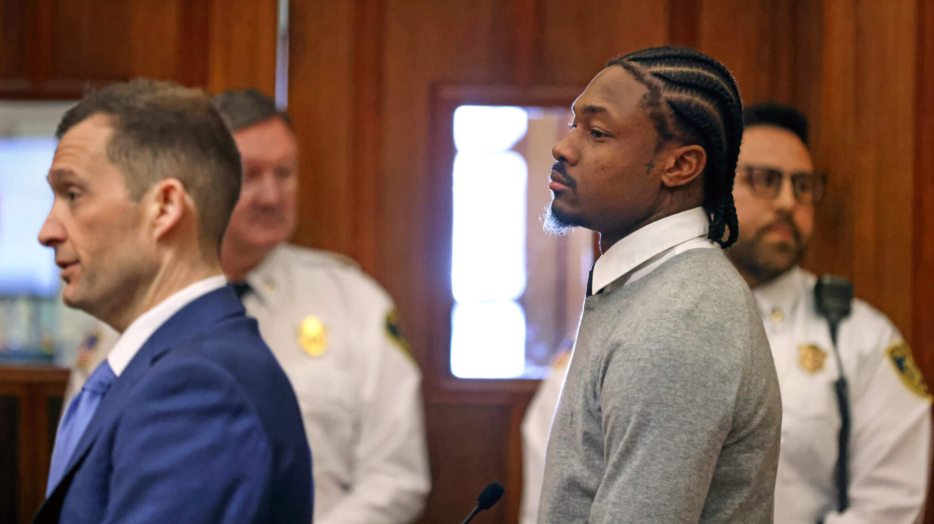 Diggs, right, appears for his arraignment on felony strangulation and a misdemeanor assault charges, Friday, at District Court in Dedham. (David L. Ryan/The Boston Globe via AP, Pool)