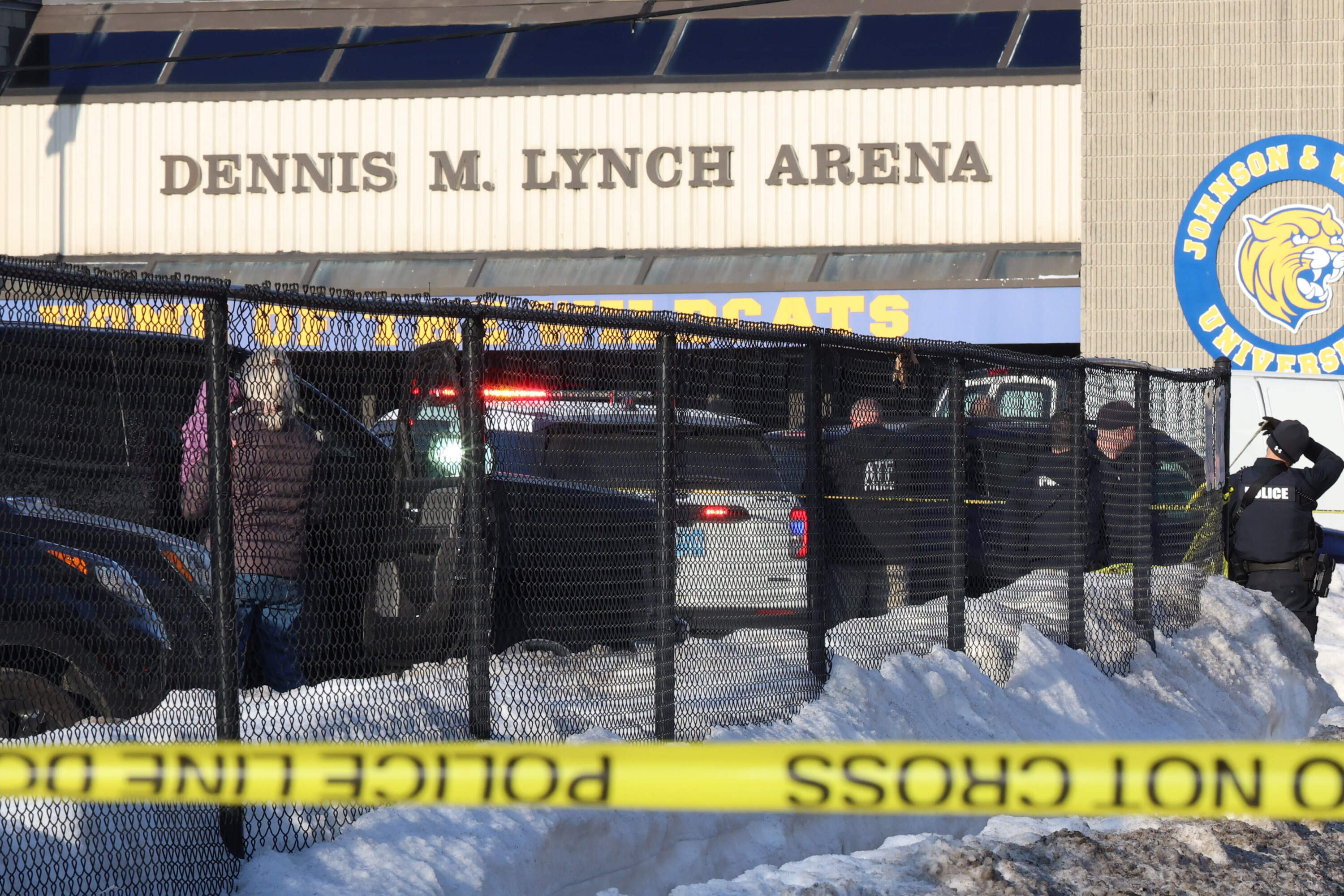 Police and ATF agents stand near the Lynch Arena in Pawtucket, R.I., after a shooting at the ice rink, Monday, Feb. 16, 2026. (Mark Stockwell/AP)
