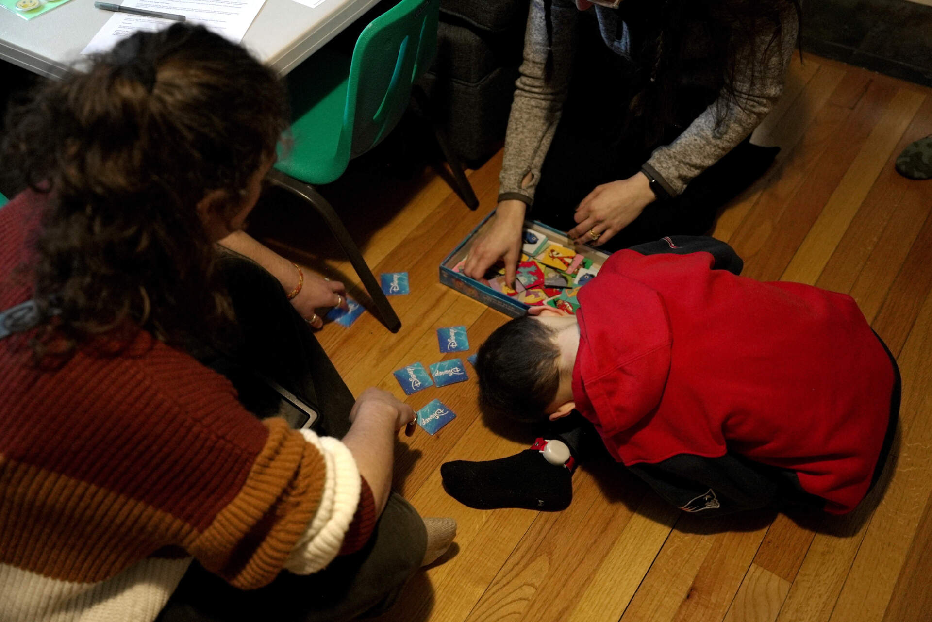 Connor Murphy takes a break from a matching problem during an applied behavior analysis after school in his home in Ayer, Mass., on Jan. 16. (Shelby Lum/AP)