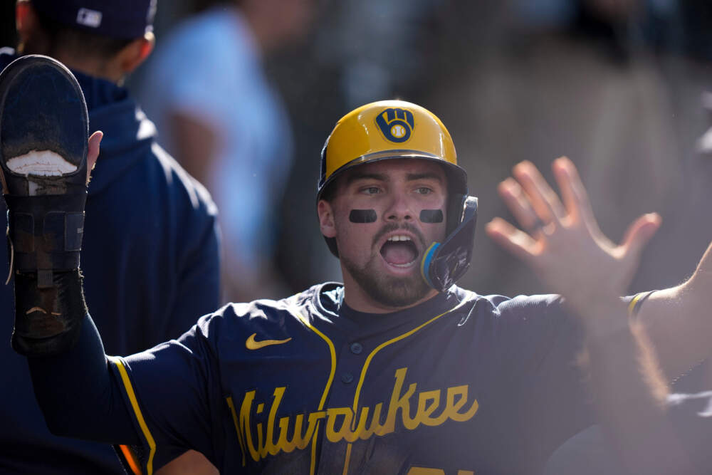 Caleb Durbin celebrates after scoring for the Milwaukee Brewers against the Los Angeles Dodgers, Oct. 16, 2025, in Los Angeles. (Brynn Anderson/AP)
