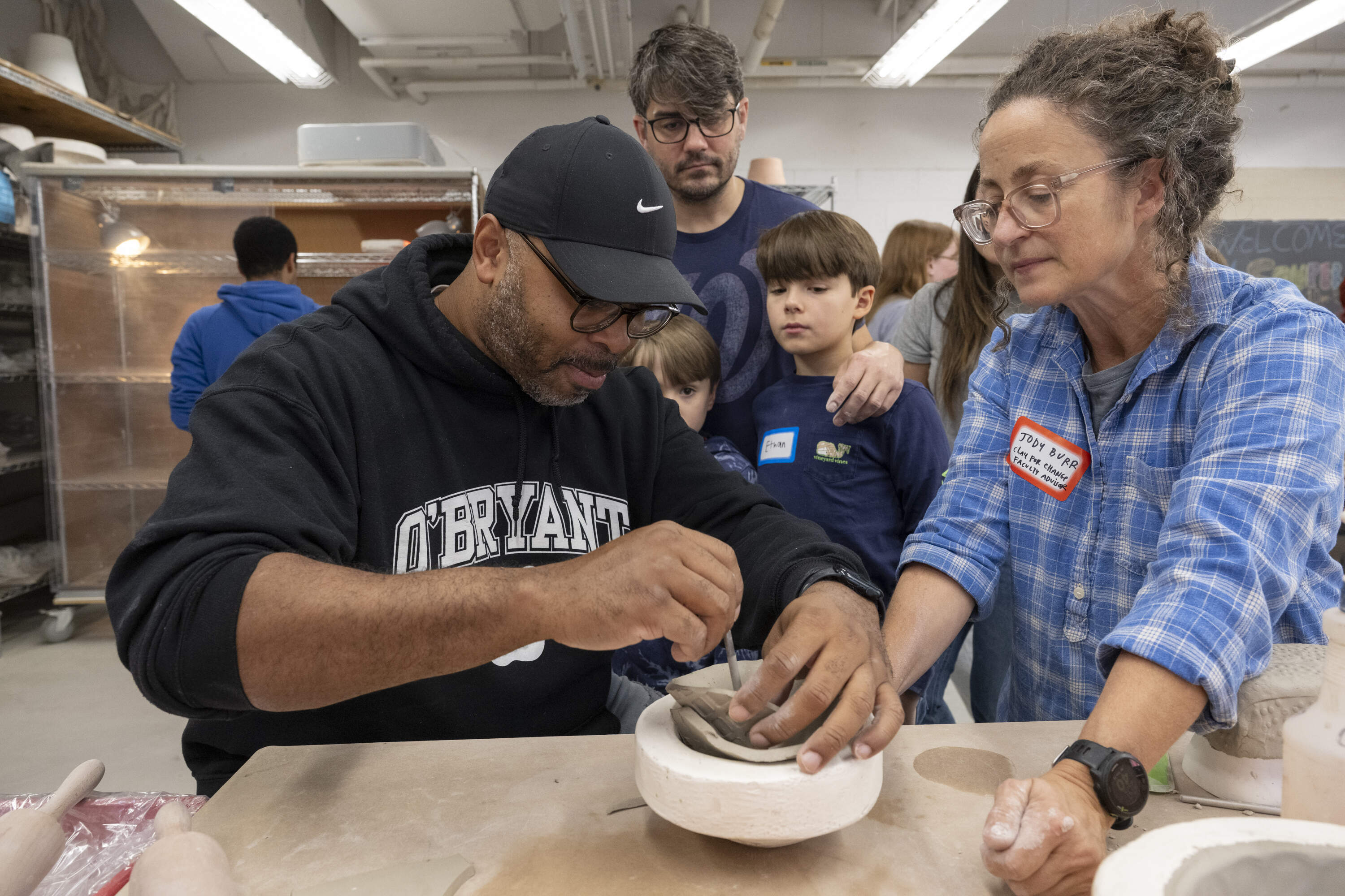 Reggie Jean, executive director of Haley House, constructs a clay bowl with Jody Burr, visiting assistant professor in 3D arts at MassArt and faculty advisor for Clay for Change. (Courtesy Melissa Ostrow)
