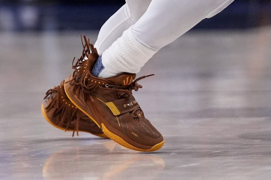 The tassels on Dallas Mavericks guard Kyrie Irving wave during the second half in Game 3 of the NBA basketball finals against the Boston Celtics, Wednesday, June 12, 2024, in Dallas. (Tony Gutierrez/AP File)