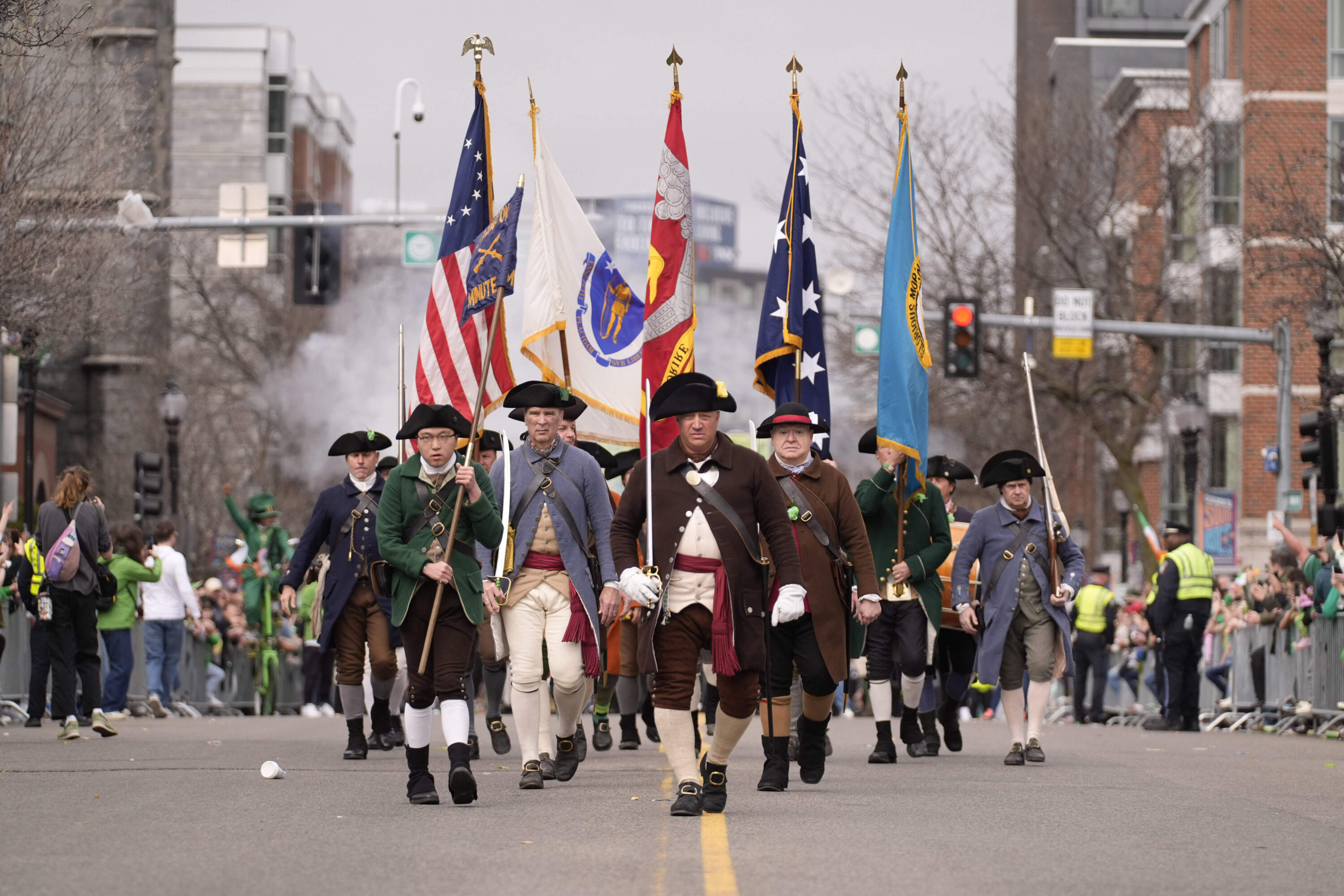 Participants dressed as Minutemen march during the 2025 St. Patrick's Day parade in South Boston. (Robert F. Bukaty/AP)