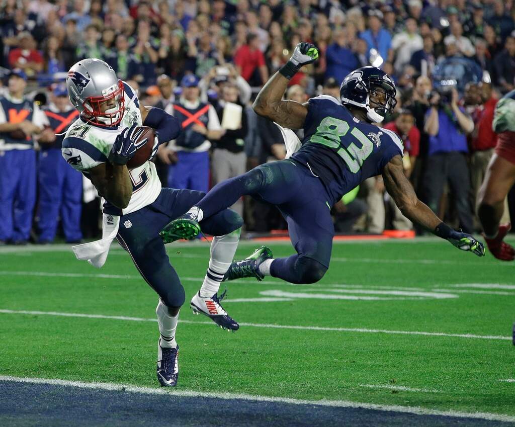New England Patriots strong safety Malcolm Butler (21) intercepts a pass intended for Seattle Seahawks wide receiver Ricardo Lockette (83) during the second half of NFL Super Bowl XLIX football game, Feb. 1, 2015, in Glendale, Arizona. (Kathy Willens/AP File)