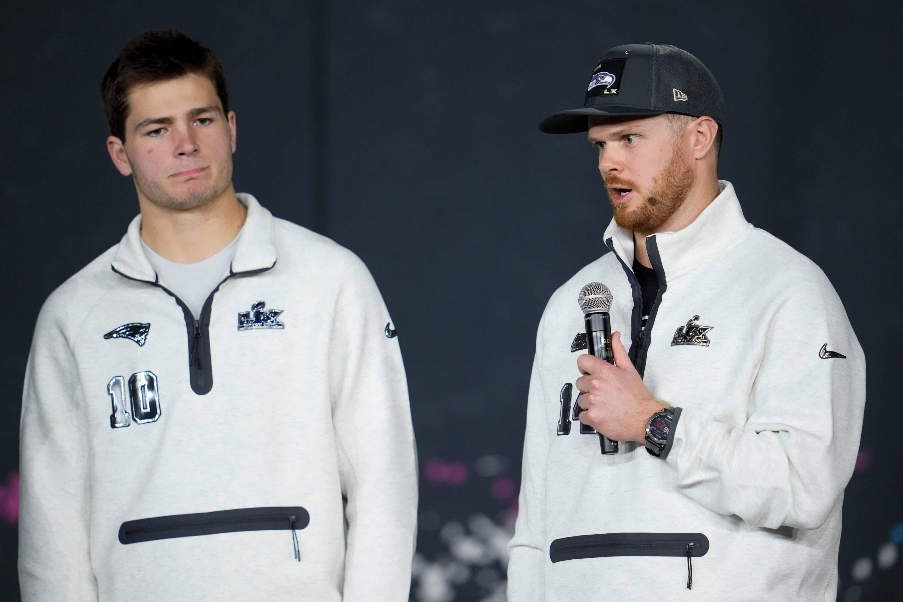 New England Patriots quarterback Drake Maye, left, and Seattle Seahawks quarterback Sam Darnold speak during the NFL Super Bowl Opening Night, Feb. 2, 2026, in San Jose, California. (Godofredo A. Vásquez/AP)