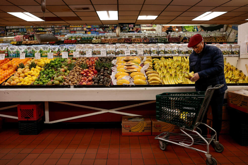 A customer shops in the produce department at Boston's Lambert's Rainbow Market on March 4, 2025. (Craig F. Walker/The Boston Globe via Getty Images)