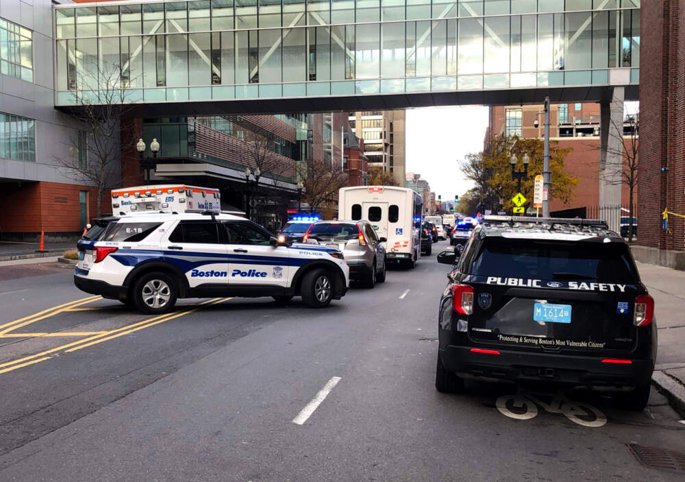 Public safety vehicles patrol Albany Street in the "Mass. and Cass" area of Boston in 2023. (Deborah Becker/WBUR file)