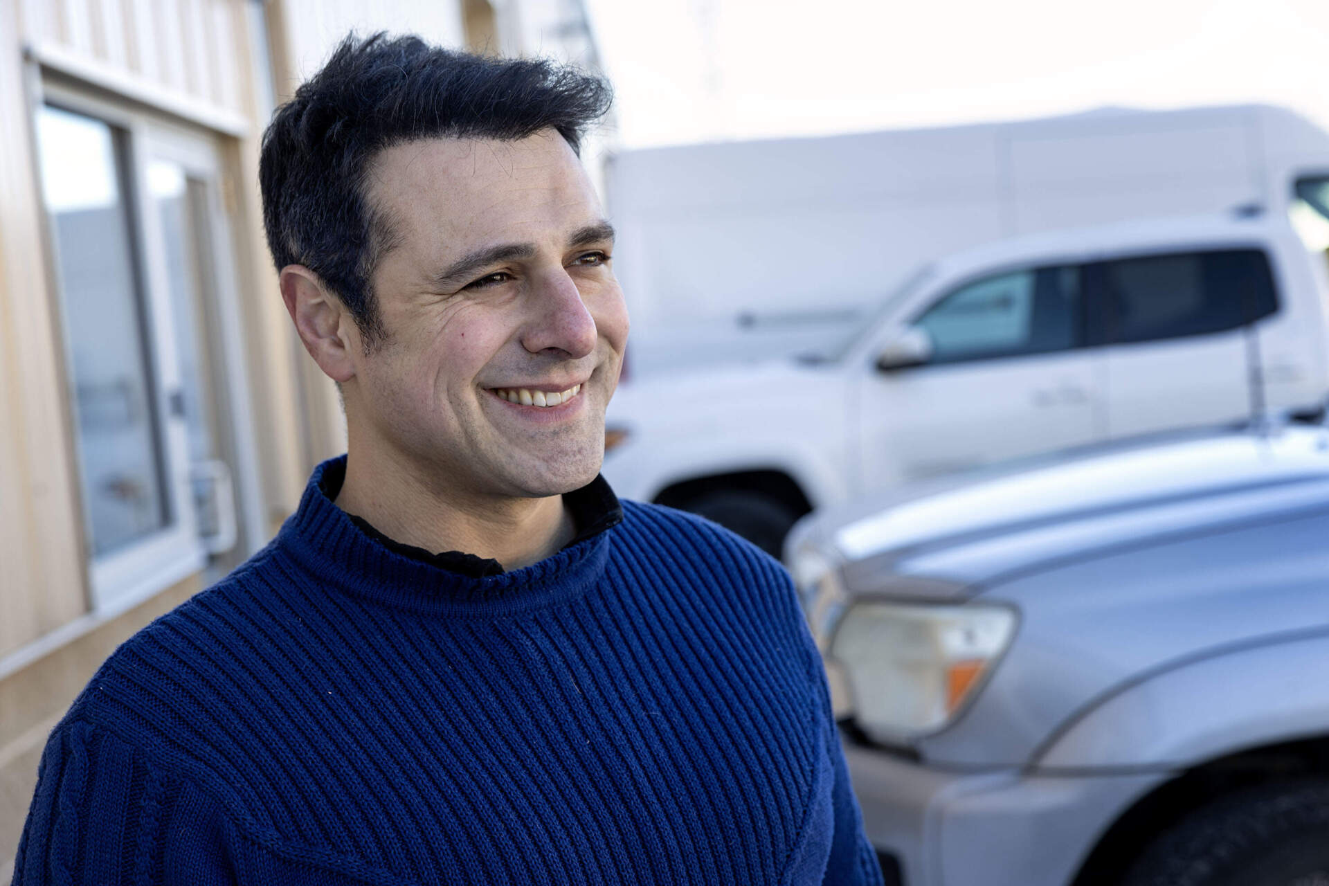 Joey Fiore, co-founder and CEO of PowerLabs, at the company's workshop in Beverly, Mass. (Robin Lubbock/WBUR)