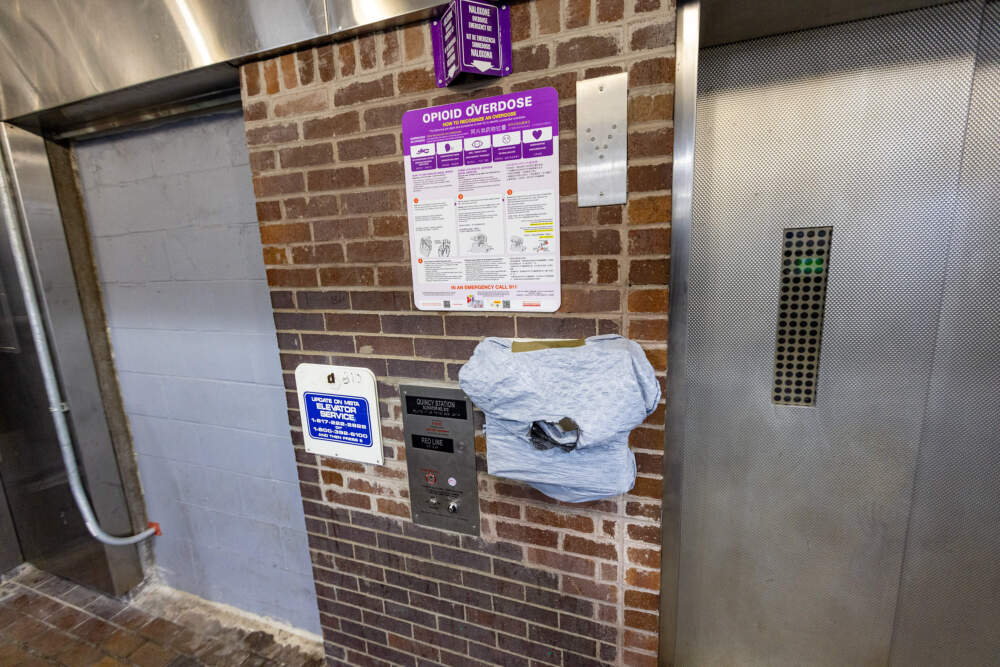 A naloxone cabinet that's been covered with a trash bag at the Quincy Center MBTA station. (Jesse Costa/WBUR)