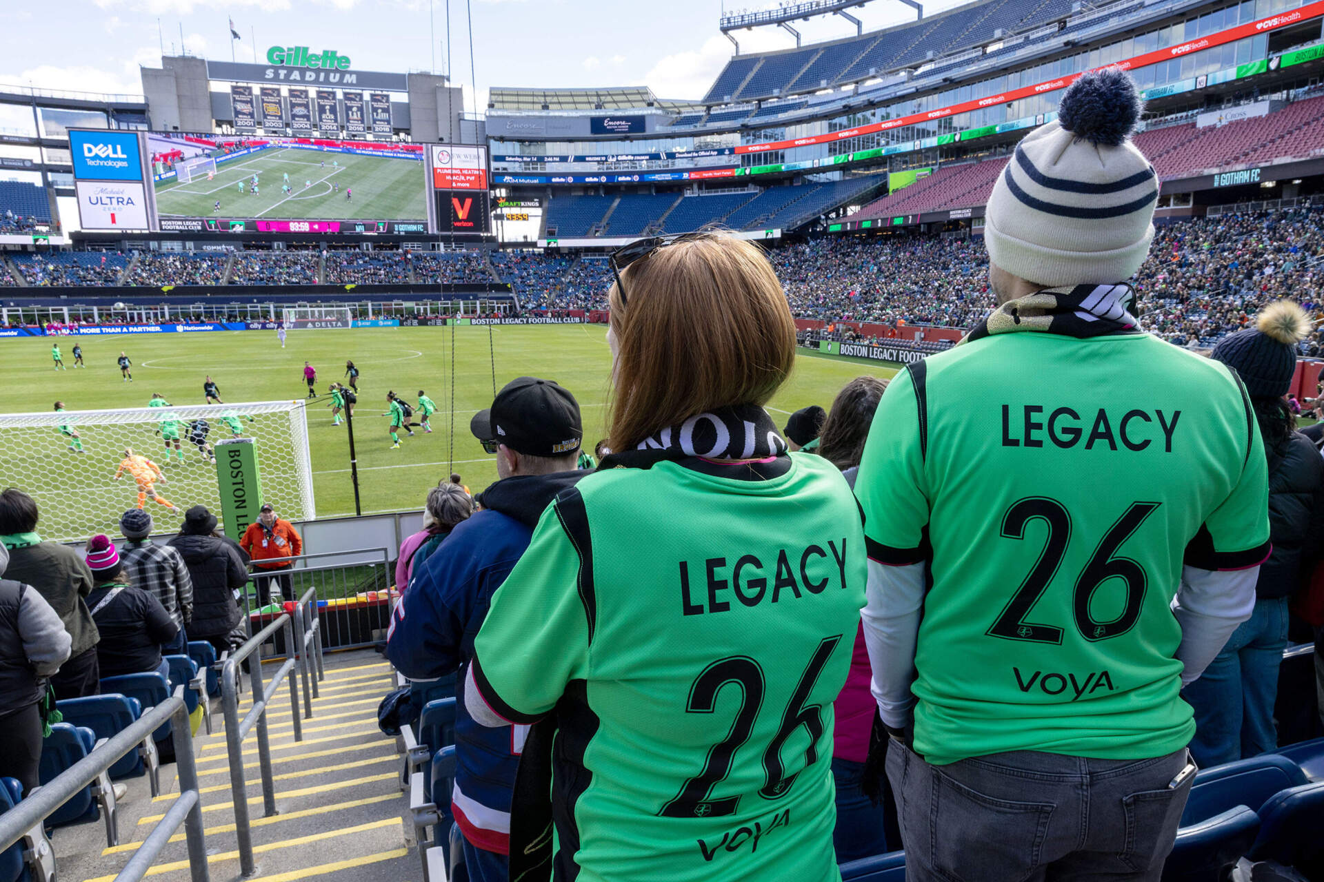 Boston Legacy FC supporters wear Legacy jerseys at the team's inaugural game, March 14, 2026. (Robin Lubbock/WBUR)