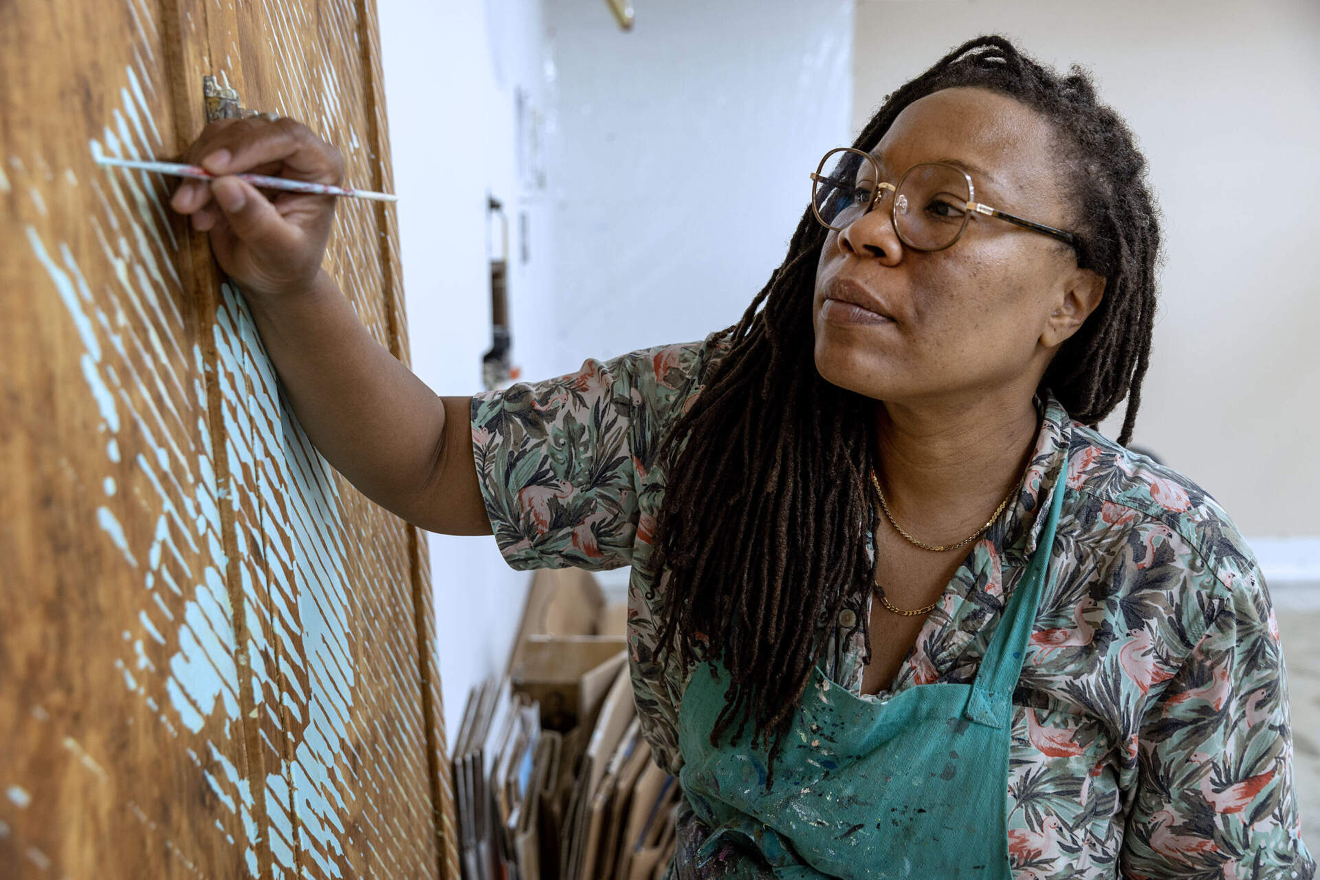 Artist Tomashi Jackson at work in her studio in Somerville, Mass. (Robin Lubbock/WBUR)