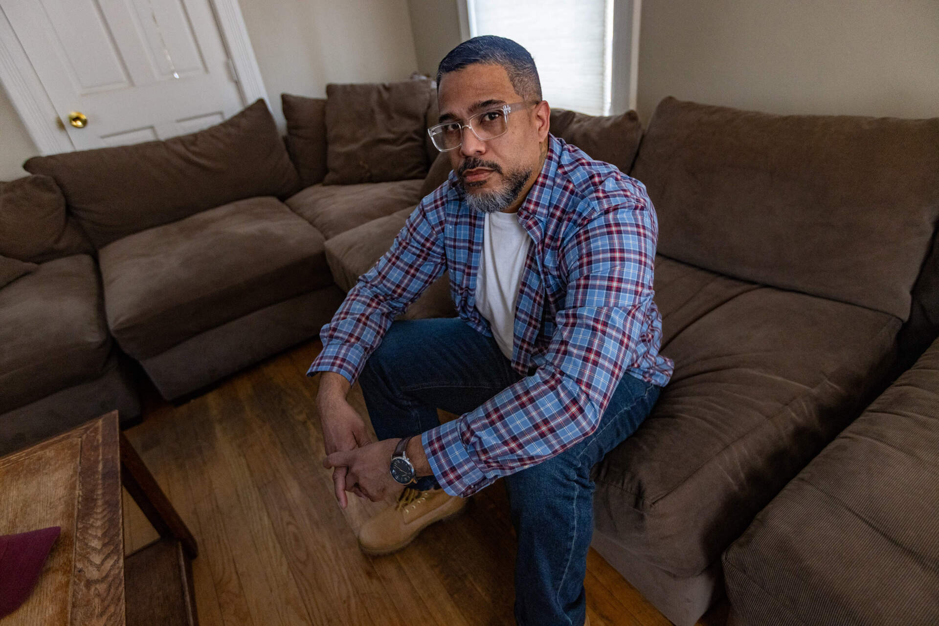 Robert Francis in the living room of Dismas House in Worcester. (Jesse Costa/WBUR)