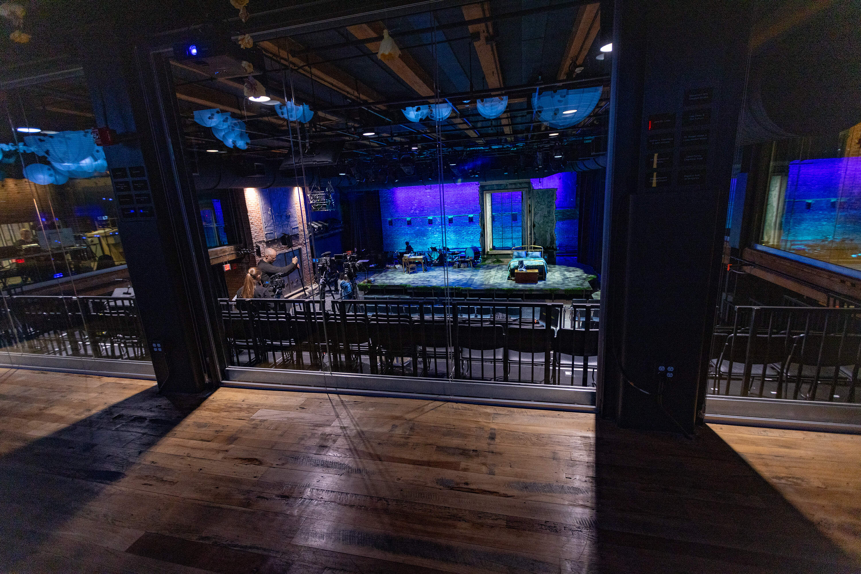 Large windows allow public viewing of rehearsals and performances from the upper lobby and lounge area at the new Boston Lyric Opera theater performing space at Midway Studios in Fort Point. (Jesse Costa/WBUR)