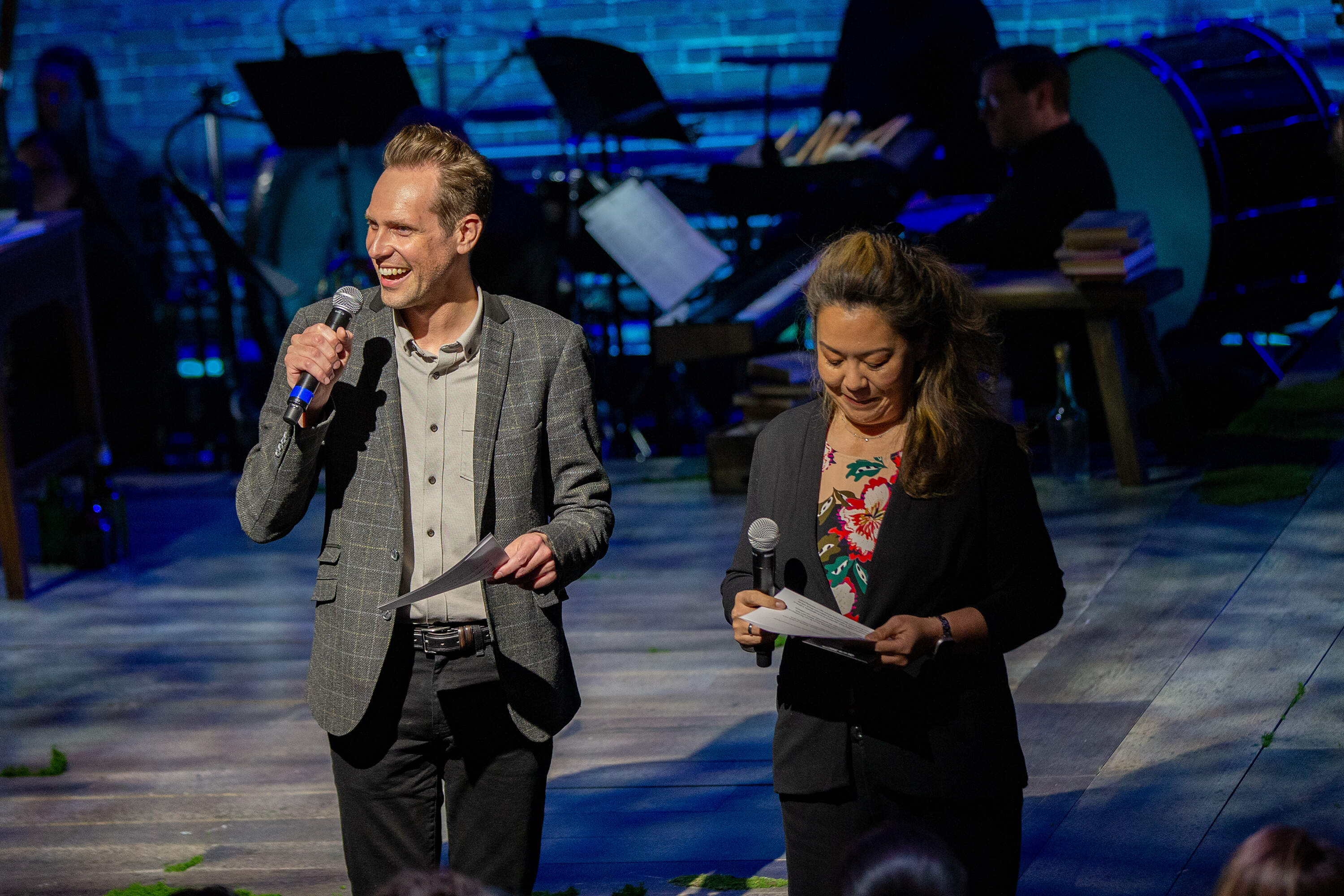 Boston Lyric Opera CEO Bradley Vernatter and artistic director Nina Yoshida Nelsen greet the audience before the final rehearsal of “The Song of the Earth” begins at the new BLO theater space at Midway Studios in Fort Point. (Jesse Costa/WBUR)