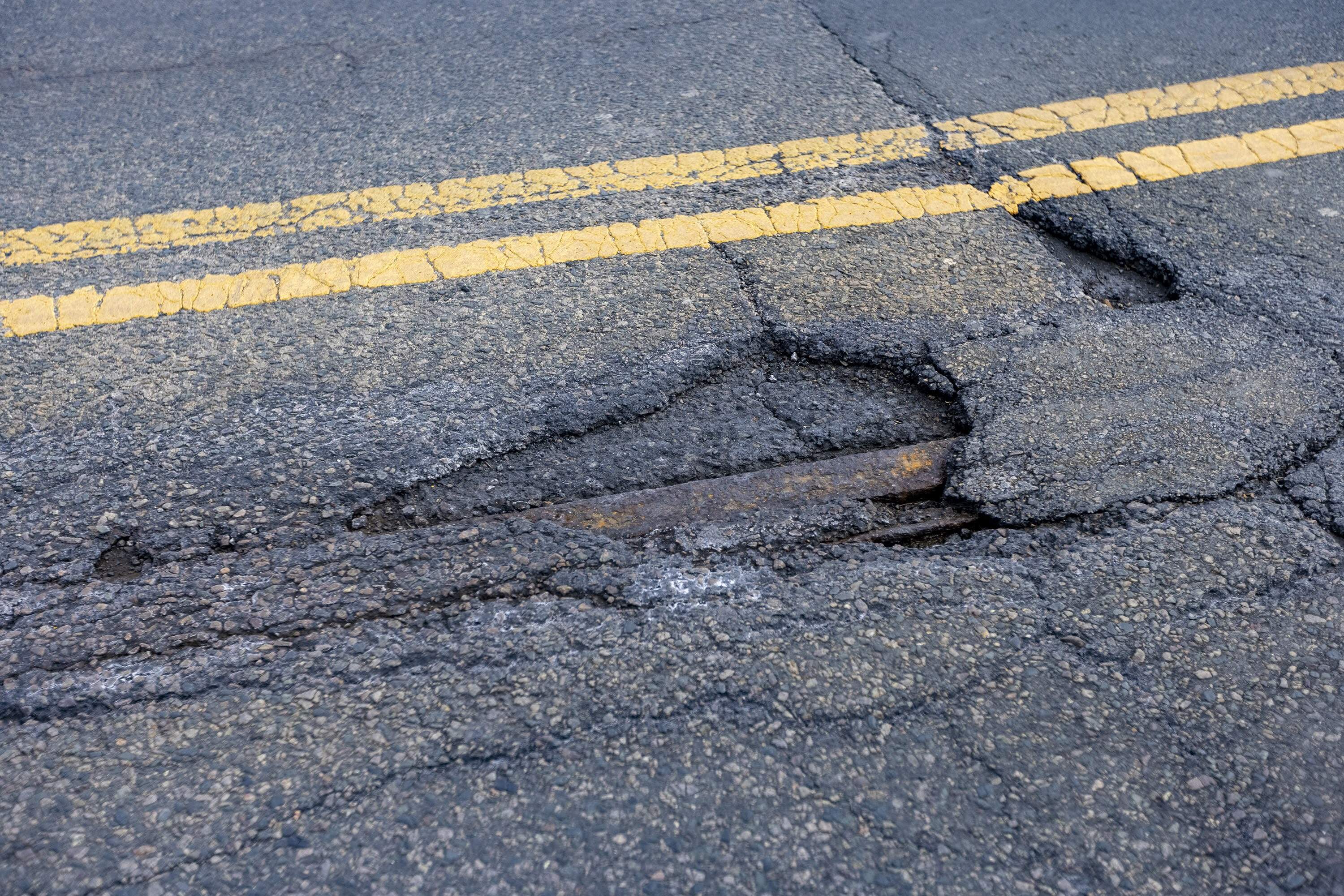 A pothole on South Huntington Avenue in Jamaica Plain in 2022. (Jesse Costa/WBUR)