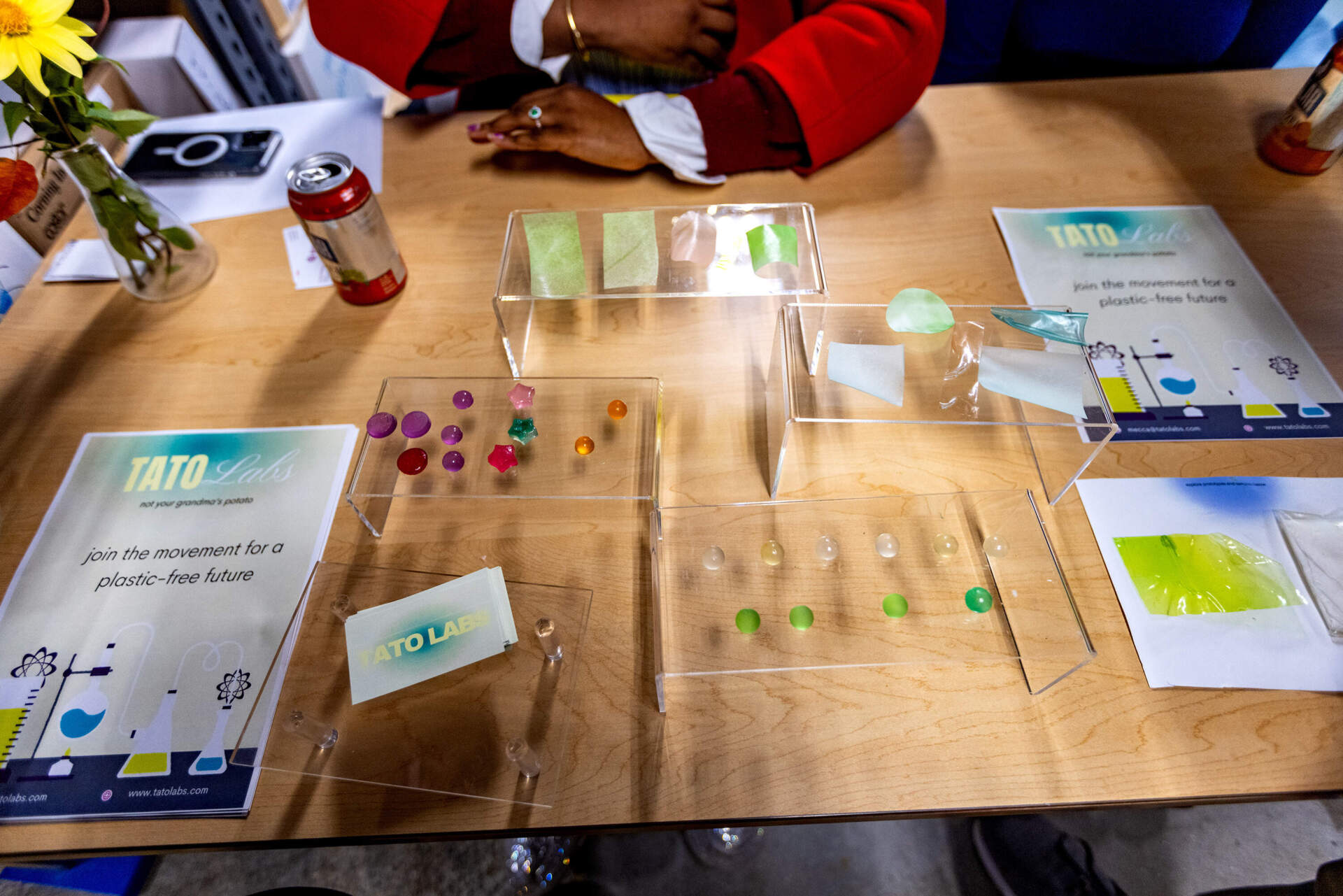 An entrepreneur displays plastic made from potatoes at Greentown Labs Climatetech Summit 2025. (Jesse Costa/WBUR)