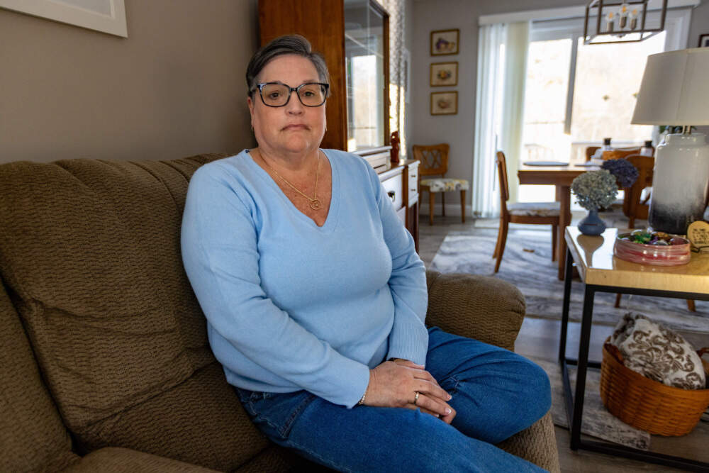 Cyndi MacKenzie at her home. She started to be abused by a priest in Southbridge, Massachusetts, when she was 4 years old. (Jesse Costa/WBUR)