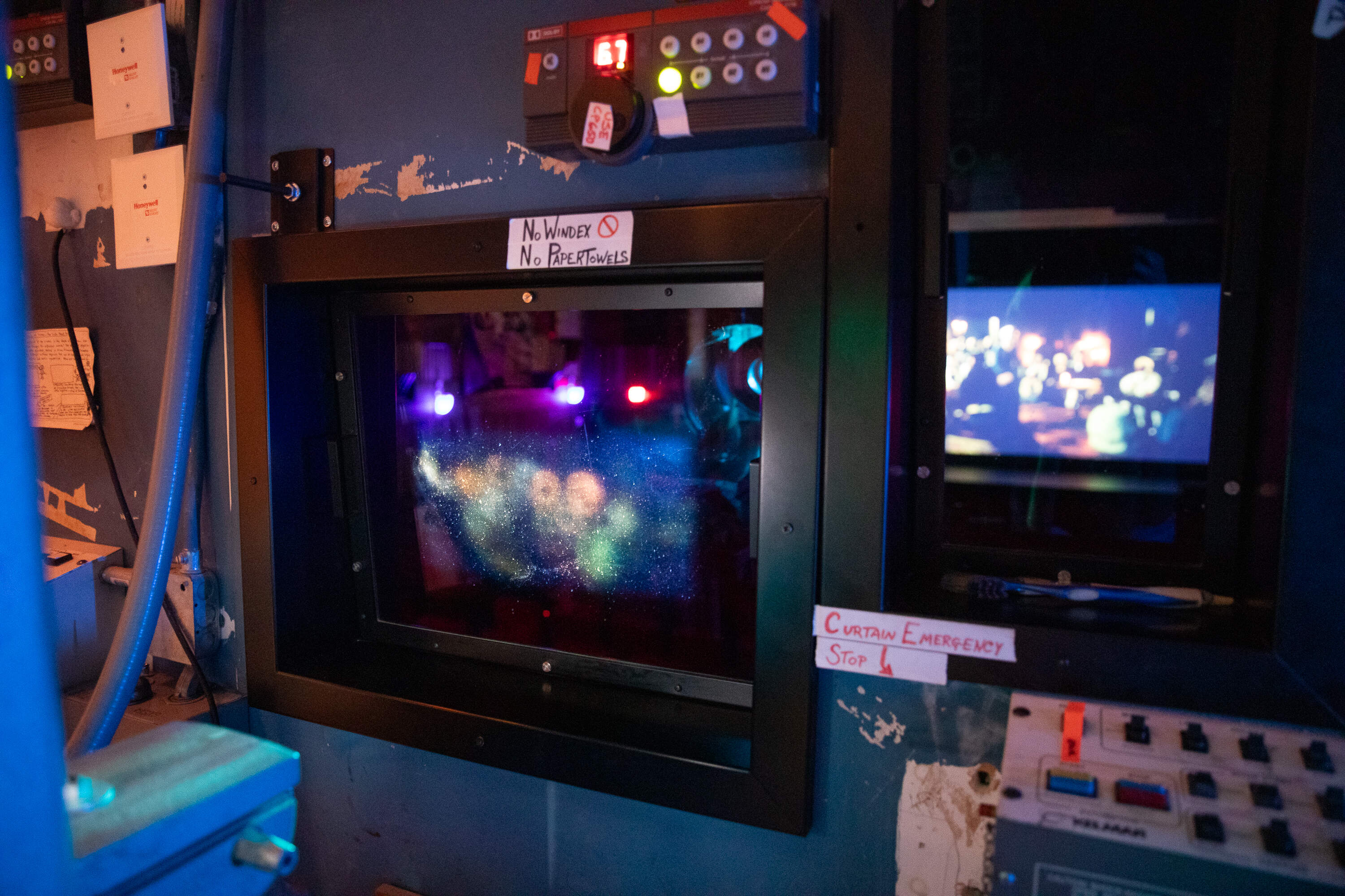 Projection booth view of Moviehouse 1 at Coolidge Corner Theater as "The Testament of Ann Lee" plays. (Artemisia Luk/WBUR)