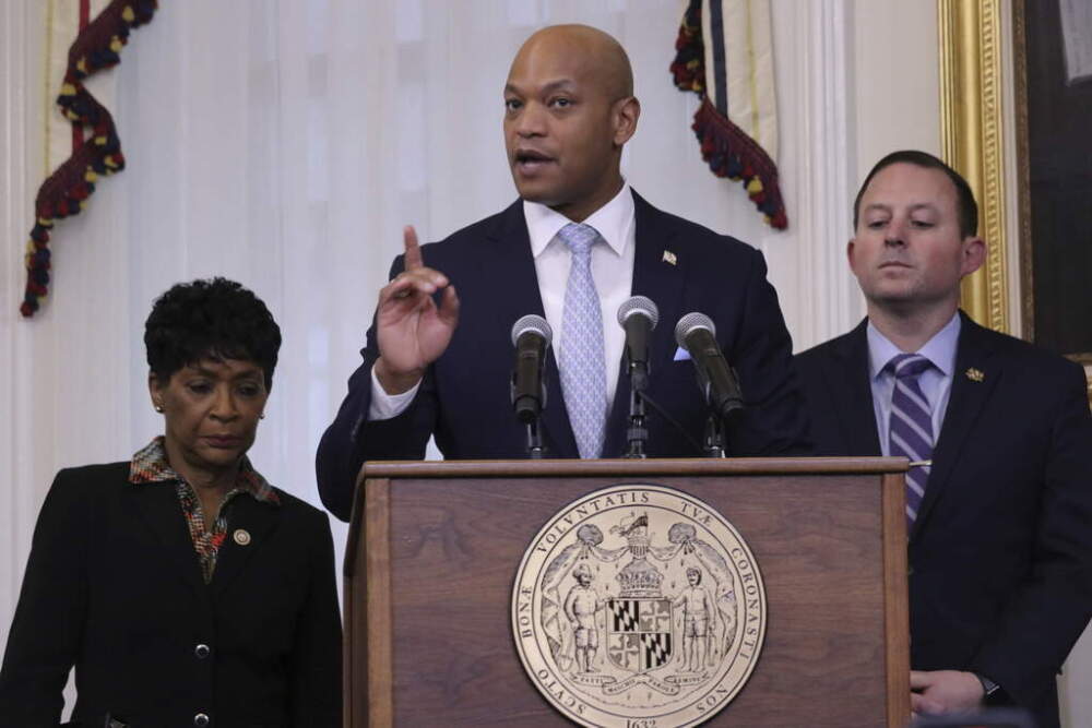 Maryland Gov. Wes Moore speaks on Thursday, May 9, 2024, after signing two measures into law that are aimed at safeguarding personal data online. Maryland House Speaker Adrienne Jones is standing left, and Maryland Senate President Bill Ferguson is standing right. (Brian Witte/ AP)