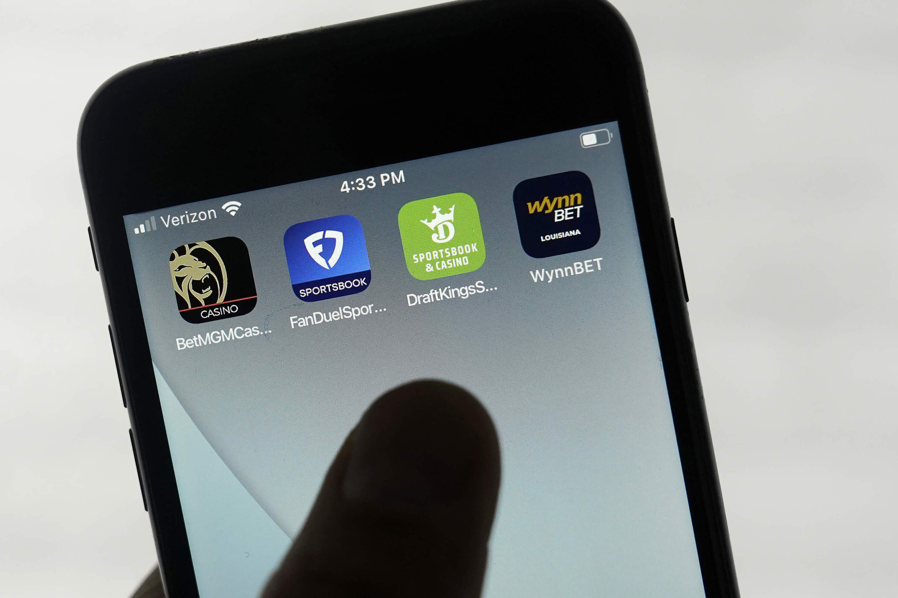 FanDuel, DraftKings and other online gambling apps are displayed on a phone in San Francisco, Sept. 26, 2022. (Jeff Chiu/AP)