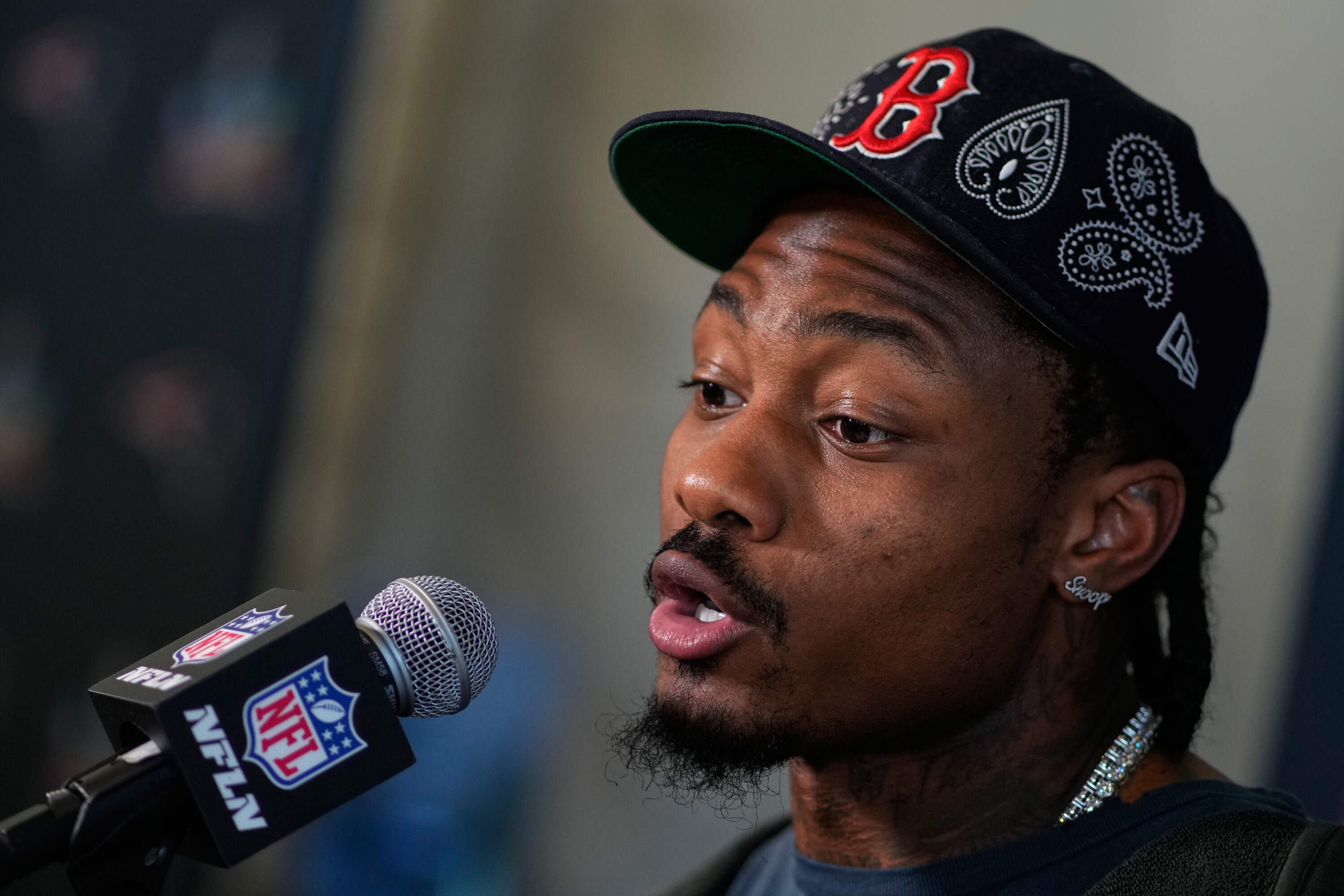 New England Patriots wide receiver Stefon Diggs talks to the media during a news conference ahead of Super Bowl 60. (Charlie Riedel/AP)