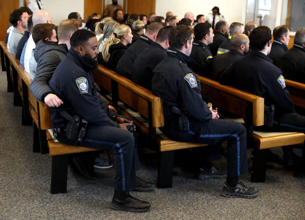 Boston Police officers attend the arraignment for their colleague, Nicholas O'Malley, in Roxbury Municipal Court in Boston. (Jonathan Wiggs/The Boston Globe, Pool via AP)