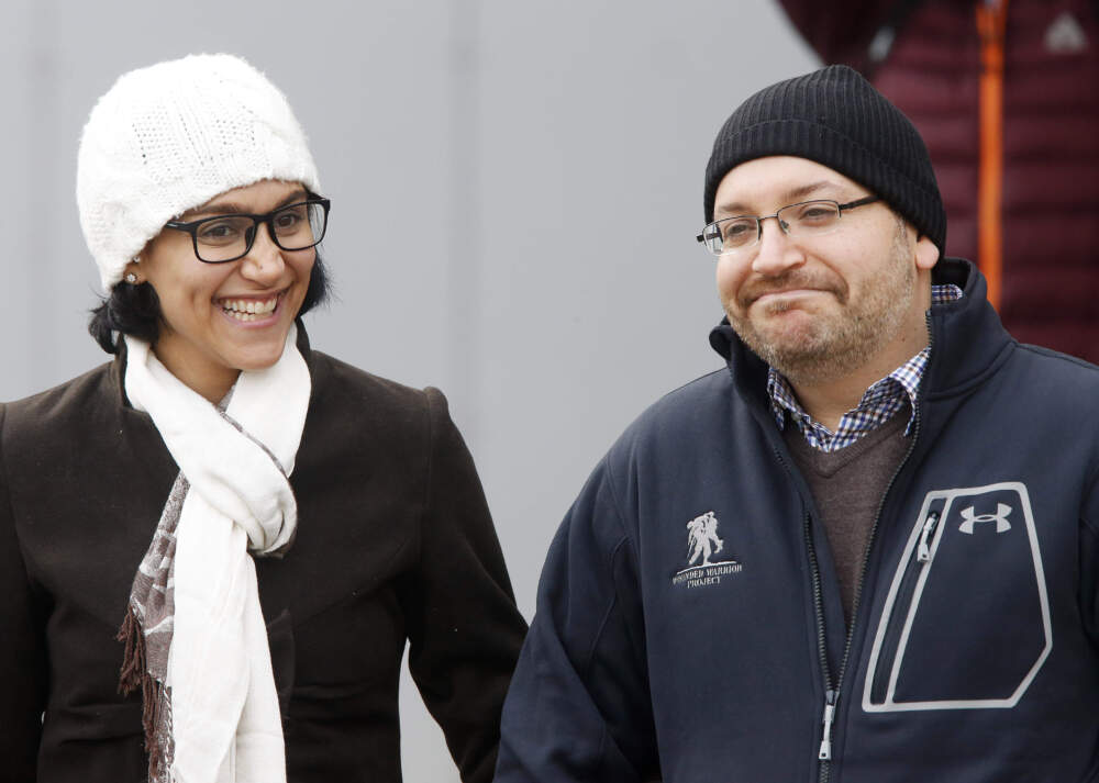 U.S. journalist Jason Rezaian smiles next to his wife Yeganeh Rezaian as he poses for media people in front of Landstuhl Regional Medical Center in Landstuhl, Germany, Wednesday, Jan. 20, 2016. Rezaian was released from an Irani prison on Jan. 16, 2016. (AP Photo/Michael Probst)