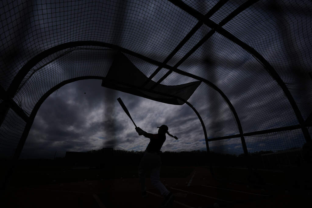 A player hits during a Women's Pro Baseball League practice in Fort Myers, Fla. (Rebecca Blackwell/AP)