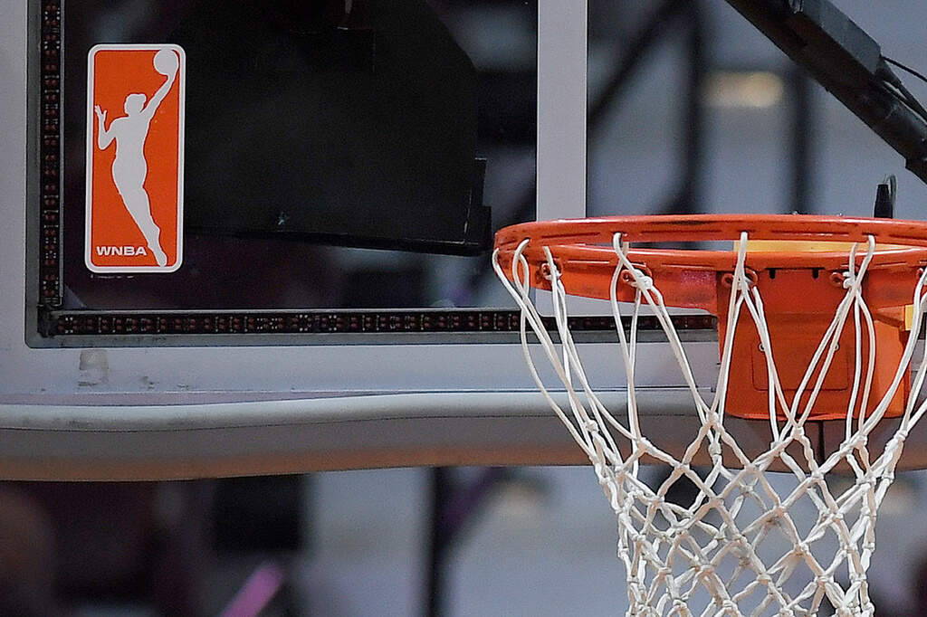 The WNBA logo is seen near a hoop before an WNBA basketball game at Mohegan Sun Arena, May 14, 2019, in Uncasville, Conn. (Jessica Hill/AP, File)