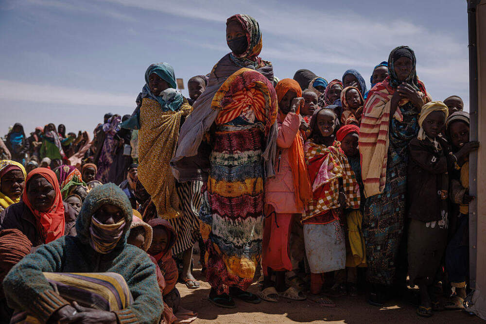 Newly arrived Sudanese refugees wait to be registered in order to collect food aid at the Oure Cassoni refugee camp on February 24 in Oure Cassoni, Chad.(Dan Kitwood/Getty Images)