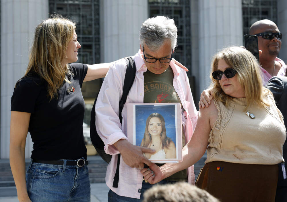 People hold a photo of a loved one outside of the Los Angeles Superior Court on March 25, 2026 in Los Angeles, California. A Los Angeles jury found social media giants Meta and Google liable for designing addictive social media platforms that harmed a young woman’s mental health. (Justin Sullivan/Getty Images)
