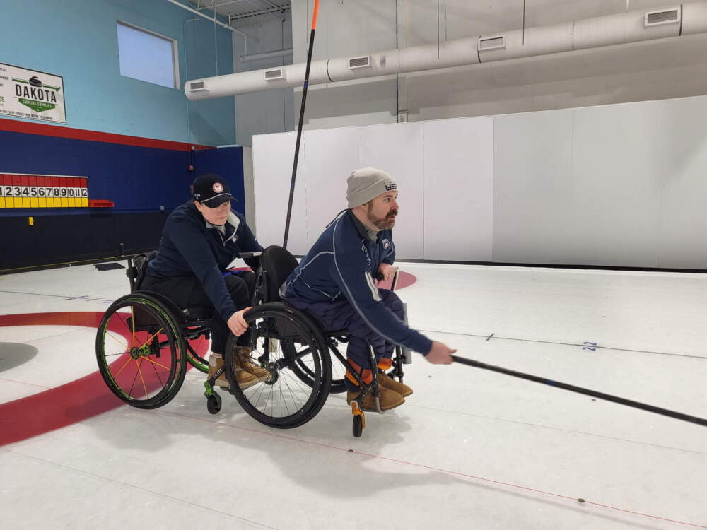 Sean O'Neill (right) launches a stone during wheelchair curling practice ahead of the Paralympics. (Courtesy of Oyuna Uranchimeg)
