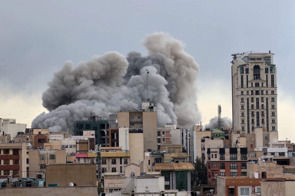 A plume of smoke rises after a strike in Tehran, Iran, Monday, March 2, 2026. (Mohsen Ganji/AP)