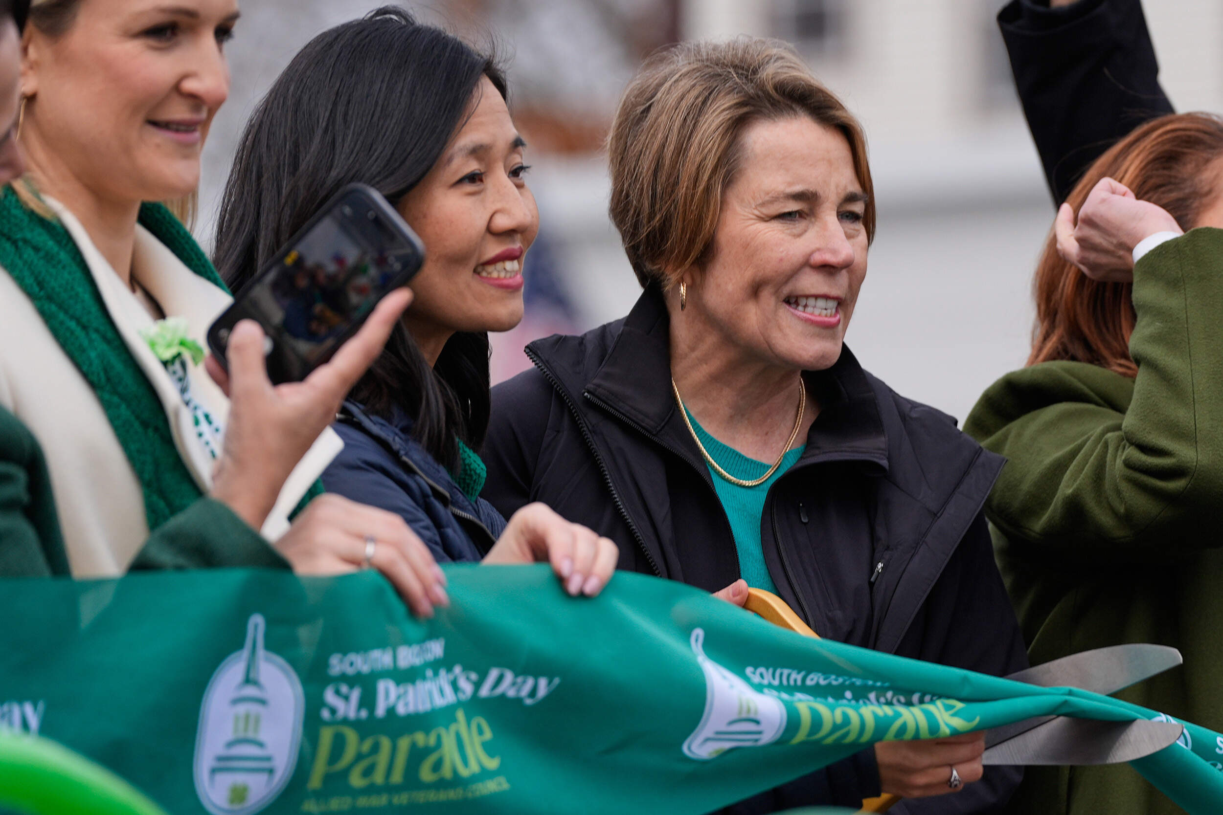 Gov. Maura Healey, right, and Boston Mayor Michelle Wu cut a green ribbon to start the annual St. Patrick's Day parade through Southie, Sunday, March 15, 2026. (Charles Krupa/AP)