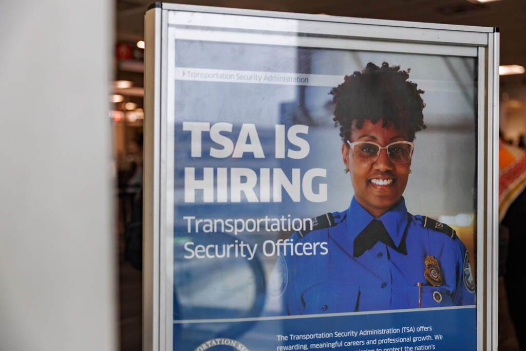 Signage reading "TSA is Hiring" at Philadelphia International Airport, Monday, March 23, 2026. (Hannah Beier/AP)