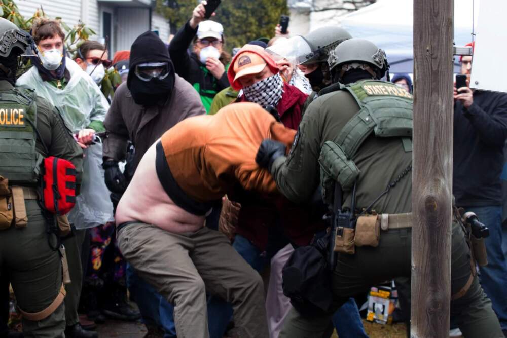 Protesters clashed with Vermont State Police and federal agents outside a South Burlington home where immigration agents planned to carry out an arrest. (Zoe McDonald/Vermont Public)