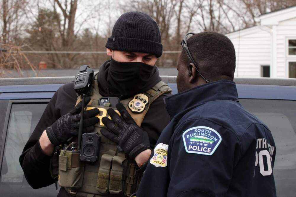 Vermont State Police, South Burlington Police and U.S. Immigration and Customs enforcement officers were at the site of a South Burlington home where protesters clashed with law enforcement during a planned ICE arrest on Wednesday, March 11. (Zoe McDonald/Vermont Public)