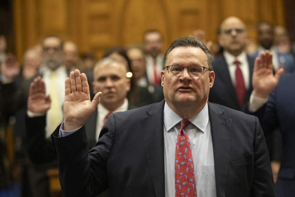 Rep. Brad Jones of North Reading, who was reelected to serve as House minority leader, and his colleagues recite the oath of office on Jan. 1, 2025. (Chris Lisinski/SHNS)