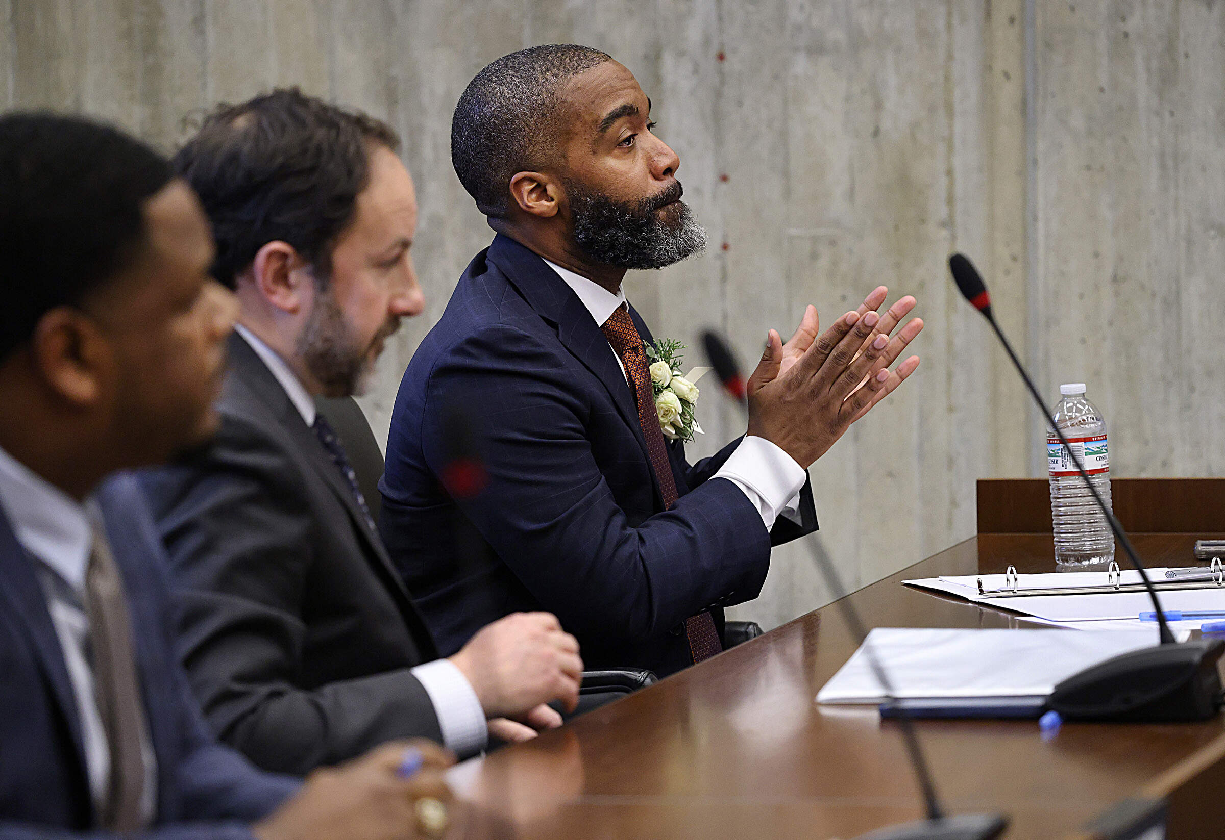 Boston City Councilor Brian Worrell claps alongside Councilor Ben Weber after the body elected its next president on Jan. 5, 2026. (Suzanne Kreiter/The Boston Globe via Getty Images file)