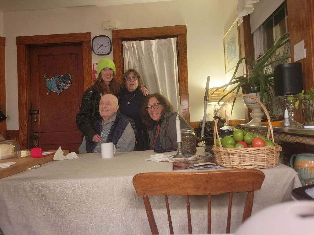 Larry Clifford seated next to the author with Clint Cavanaugh, wearing a hat, and Sally Corley in 2023. (Courtesy Deb Becker)