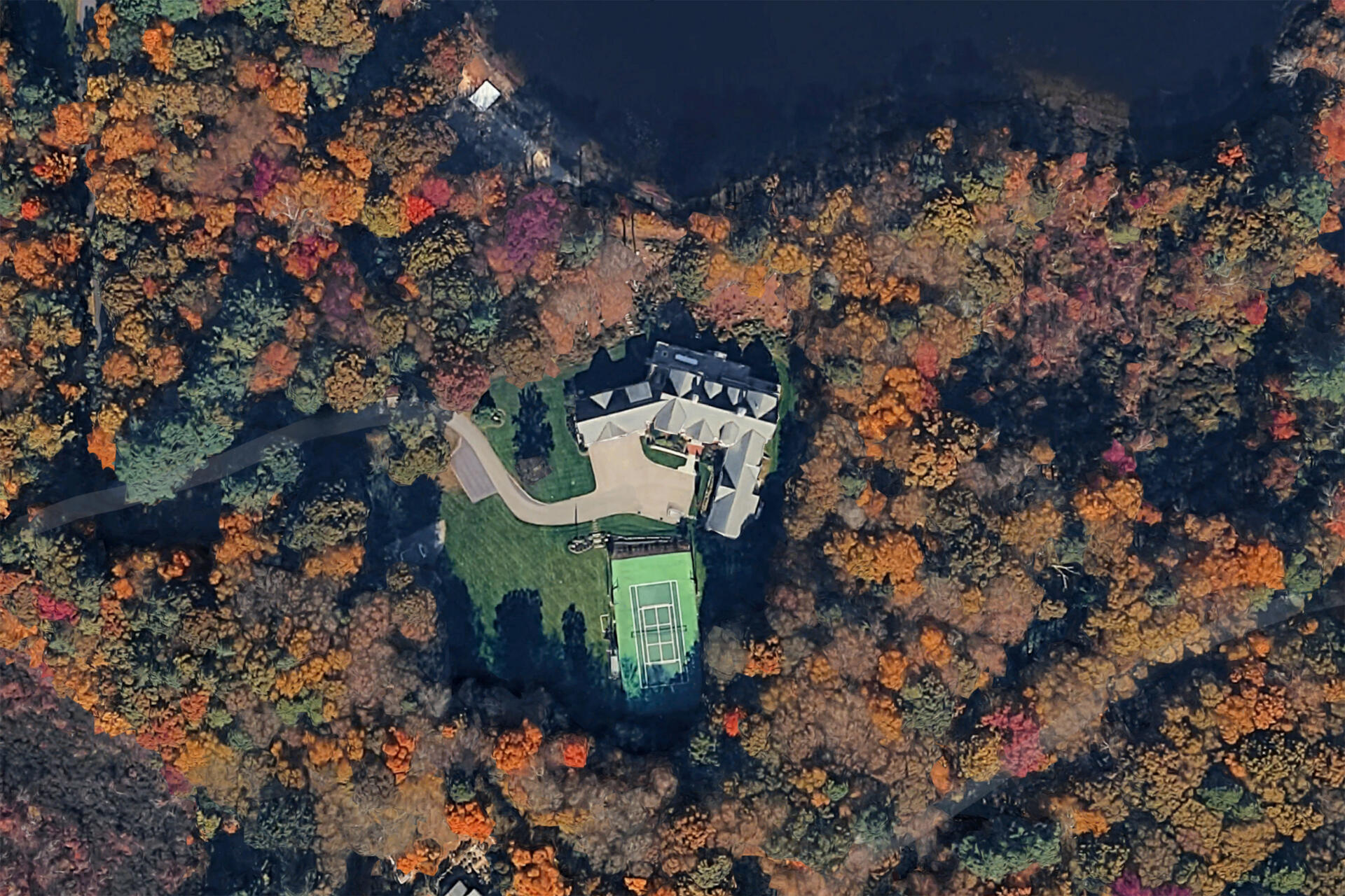 Mike Minogue's 8,200-square-foot home in South Hamilton has six bedrooms and a tennis court. Its last assessment valued it at $3.5 million. (Screenshot Google Maps)