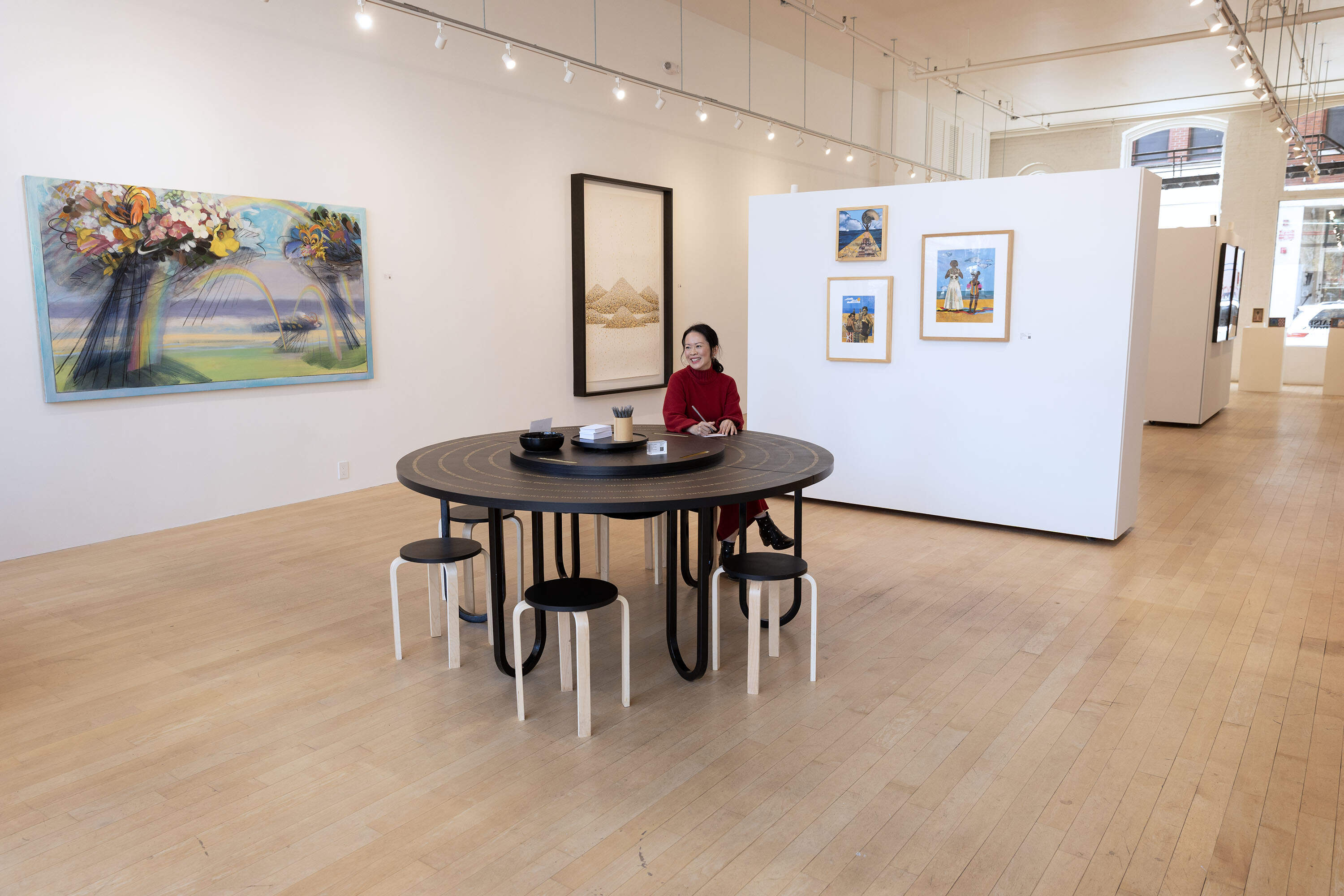 Gallery founder Yng-Ru Chen at the Praise Shadows Art Gallery on Kingston Street in Boston. (Robin Lubbock/WBUR)