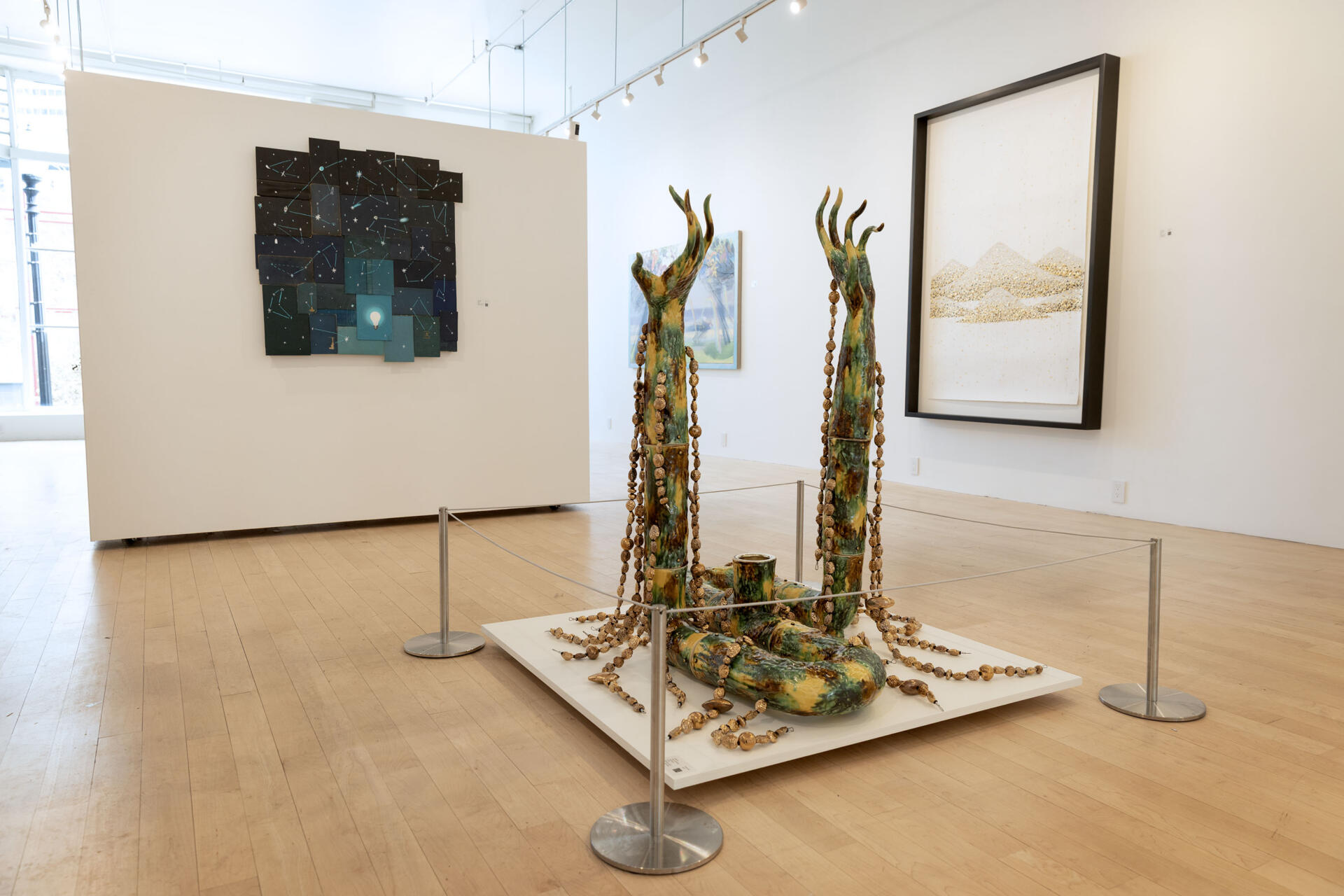 "Nuwa with Peach Pit Strands" a sculpture by Cathy Lu at the Praise Shadows Art Gallery on Kingston Street in Boston. (Robin Lubbock/WBUR)