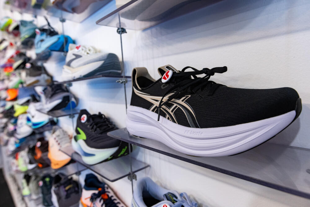 Wall display of running shoes at Heartbreak Hill Running Company. (Jesse Costa/WBUR)