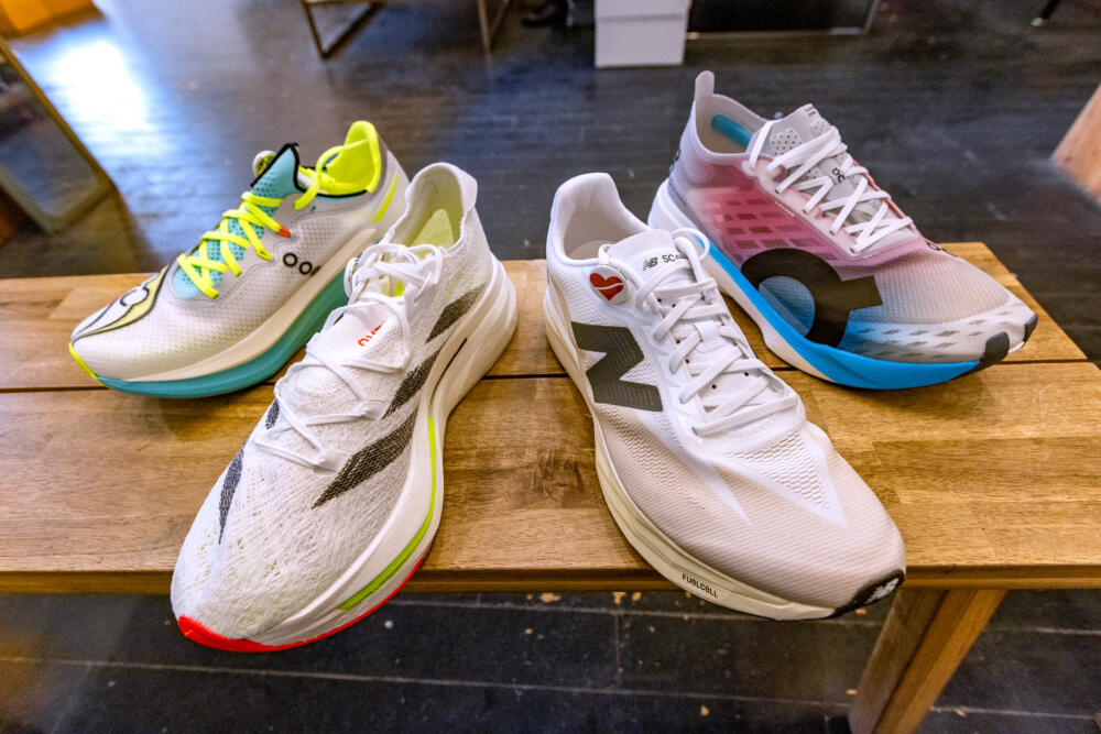 Some of the super shoes at Heartbreak Hill Running Company including the Saucony Endorphin Pro 5, the Adidas Adizero Prime X 2, the New Balance SuperComp Elite and the Cloudboom Strike. (Jesse Costa/WBUR)