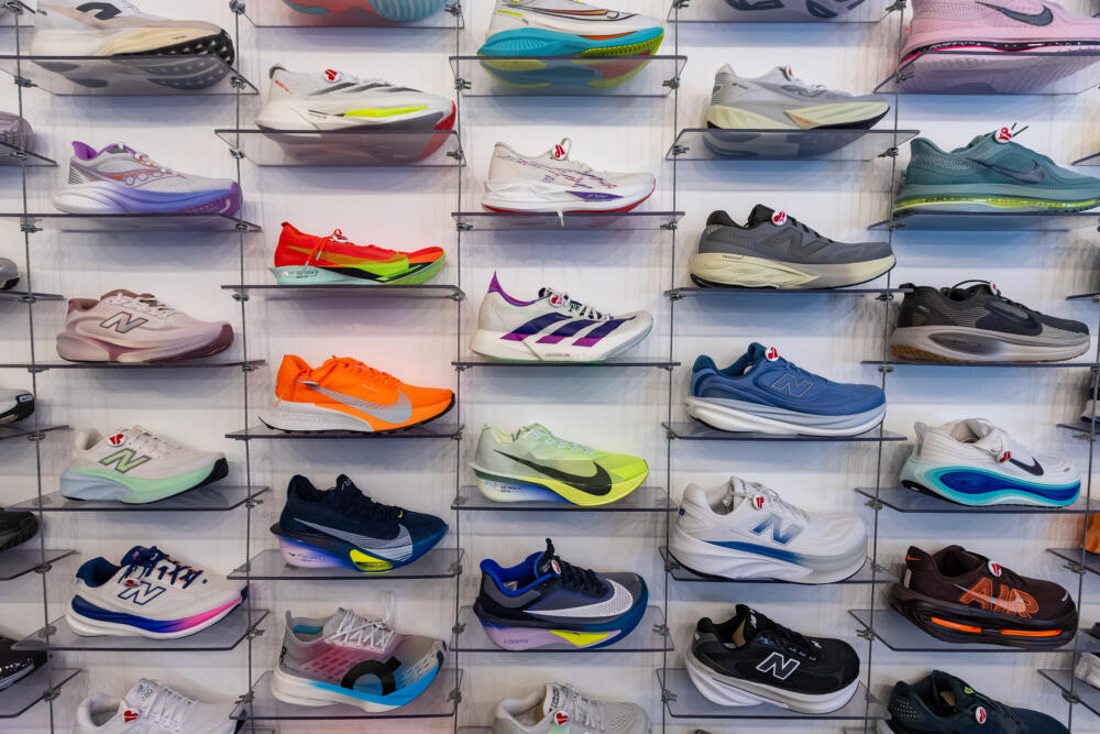 Wall display of running shoes at Heartbreak Hill Running Company in Boston's South End. (Jesse Costa/WBUR)