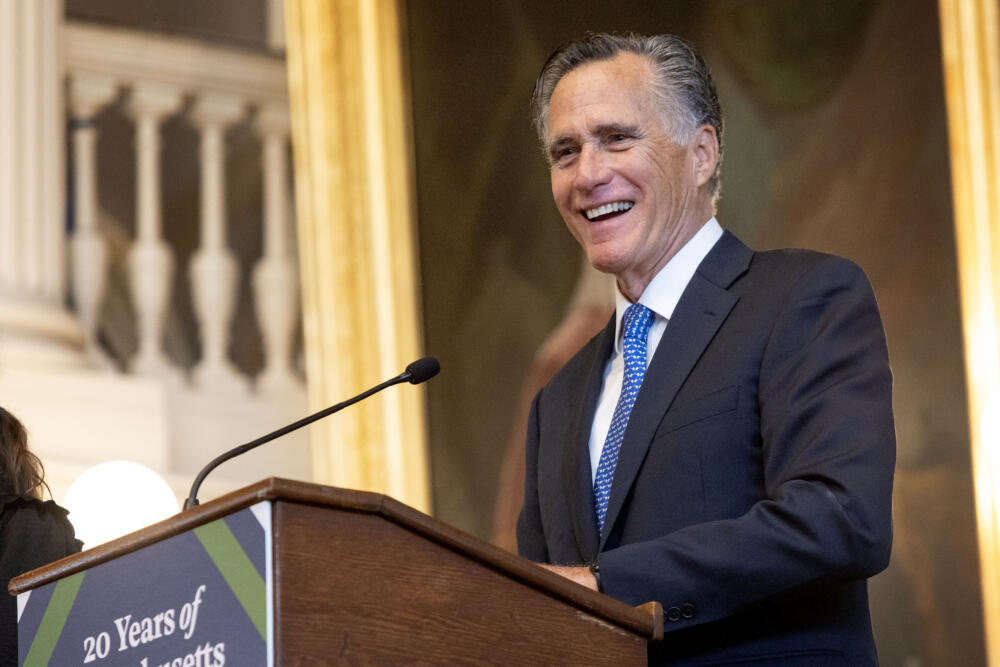 Former Governor Mitt Romney speaks at a gathering in Faneuil Hall to celebrate 20 years of Massachusetts health care reform. (Robin Lubbock/WBUR)