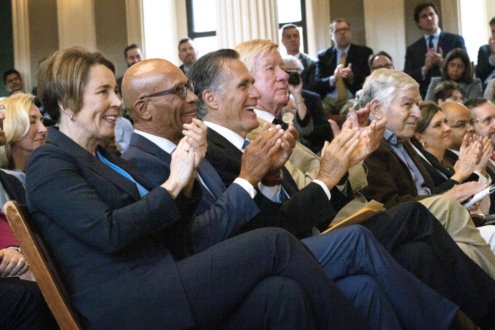 Five governors of Massachusetts: Maura Healey, Deval Patrick, Mitt Romney, Bill Weld and Michael Dukakis. (Robin Lubbock/WBUR)
