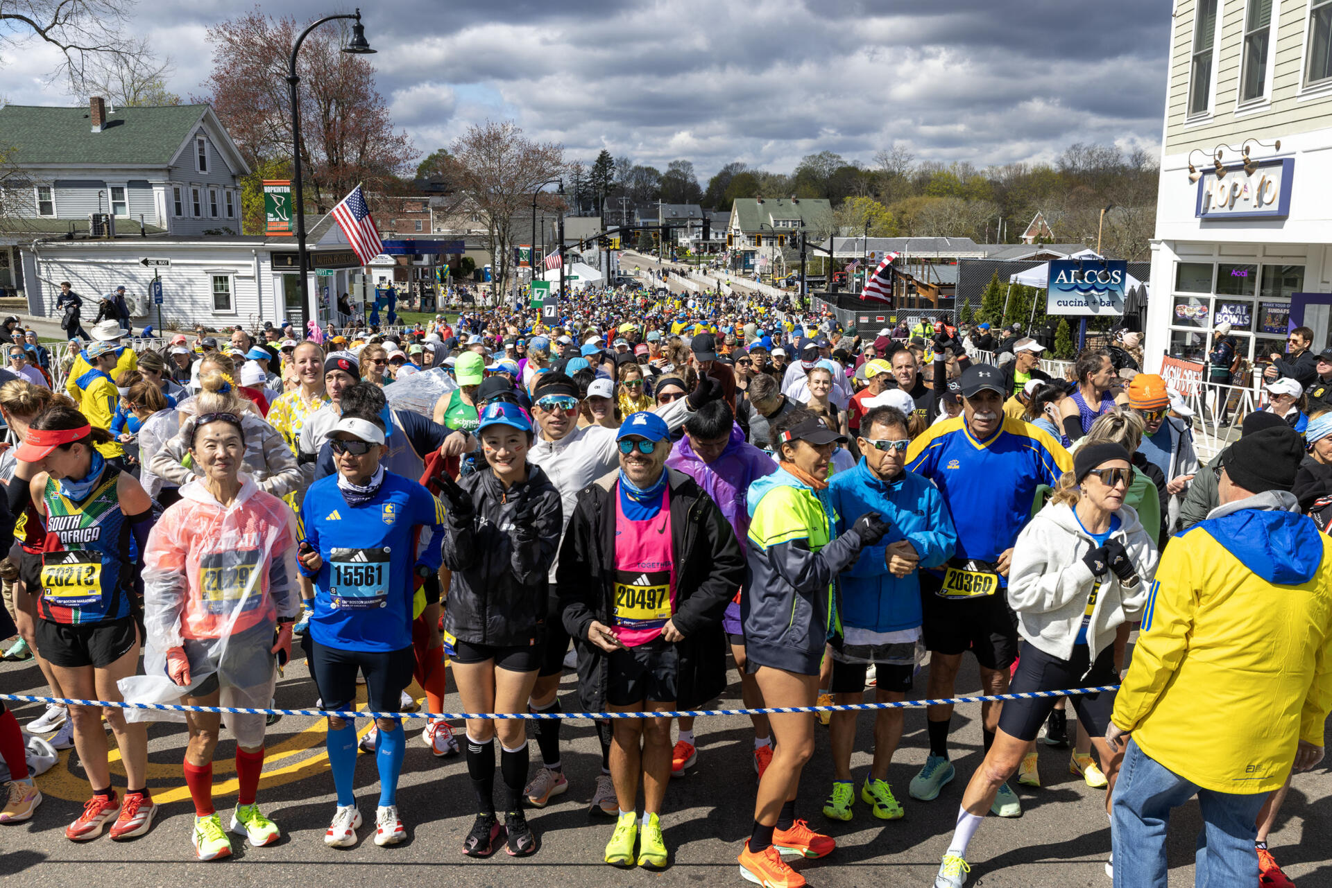 Runners in the 130th Boston Marathon wait to move up to the start line in Hopkinton. (Robin Lubbock/WBUR)