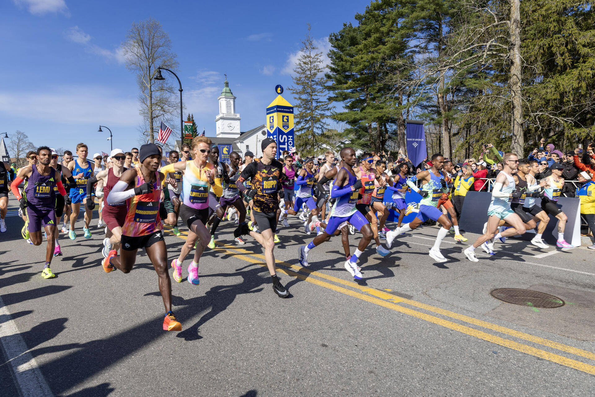 Professional men's field leave the start line of the 130th Boston Marathon. (Robin Lubbock/WBUR)